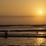 Coucher de soleil à Huanchaco et pêcheur sur son 